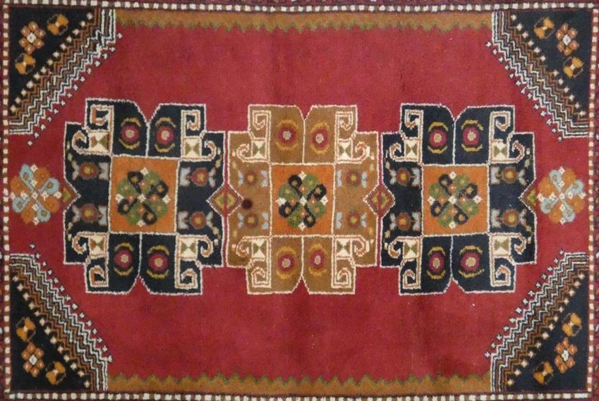 A Turkish Kars rug with repeating medallions on madder ground within spandrels and stylised lotus - Image 2 of 3
