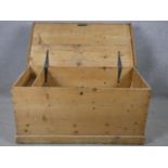 A 19th century pine storage trunk fitted with candle box on plinth base. H.46 W.93 D.48cm