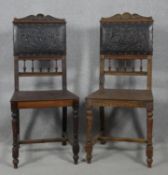 A pair of late 19th century oak hall chairs in embossed leather upholstery on turned and stretchered