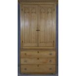 A 19th century pine kitchen pantry cabinet with shaped dentil cornice above Gothic arched panelled