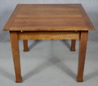 A mid century oak draw leaf dining table on square tapering supports. H.72 L.151 W.91cm