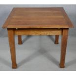 A mid century oak draw leaf dining table on square tapering supports. H.72 L.151 W.91cm