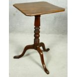 A 19th century mahogany tilt top occasional table on turned pedestal and tripod cabriole supports.