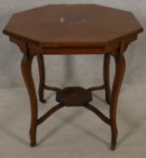 An Edwardian mahogany and satinwood strung occasional table with central floral inlay on cabriole