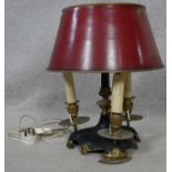 A vintage brass and metal three branch bouillotte lamp with toleware shade. H.40cm