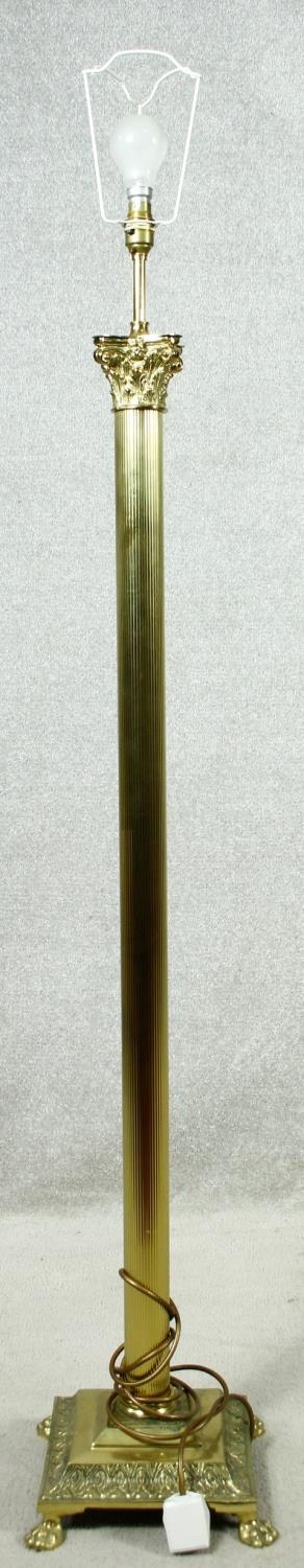 A brass Corinthian column standard lamp. H.154cm