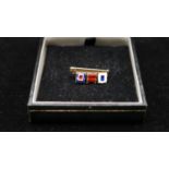 A 9ct signal flag sweetheart brooch, spells SBW, each flag enamelled. Hallmarked JWB, Birmingham,