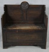 An early 20th century country antique style oak hall bench with hinged lidded seat and coffer