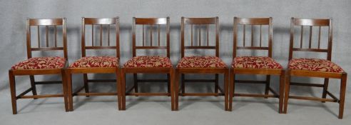 A set of six 19th century mahogany bar back dining chairs with reeded slats above drop in seats on