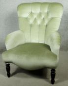 A Victorian style bedroom chair in deep buttoned velour upholstery on turned supports. H.86 W.55 D.