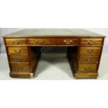 A C.1900 mahogany three section partner's pedestal desk with inset tooled leather top above an