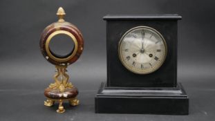 An ormolu and marble clock case on triple Trafalgar dolphin support and feet along with a late