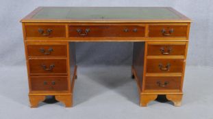 A Georgian style pedestal desk with inset leather top on bracket feet. H.79 W.137 D.69cm (missing