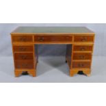 A Georgian style pedestal desk with inset leather top on bracket feet. H.79 W.137 D.69cm (missing