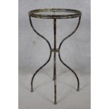 A shaped wrought metal conservatory occasional table with inset plate glass top. H.80cm