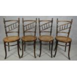A set of four late 19th century Continental beech framed bentwood cafe style dining chairs with rail