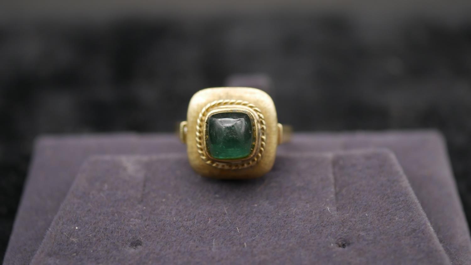 A 14 carat yellow gold and tourmaline dress ring. Set with a sugar loaf tourmaline with an