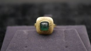 A 14 carat yellow gold and tourmaline dress ring. Set with a sugar loaf tourmaline with an