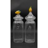 A pair of large Art Glass preserve jars with lemon finials to the lids. H.40cm