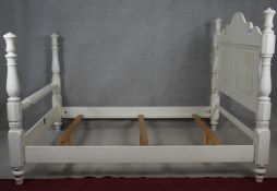 A painted American Colonial style bedstead to take a 5ft mattress.