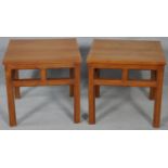 A pair of Chinese influenced hardwood lamp tables on square section supports. H.45 L.48 W.47cm