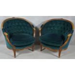 A pair of French style carved beech framed tub armchairs in deep buttoned velour upholstery on