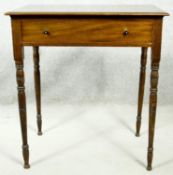 A 19th century style mahogany side table with frieze drawer on tapering ring turned supports. H.72