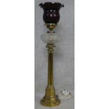 A tall 19th century brass oil lamp with clear cut glass reservoir, converted to electricity. H.82cm
