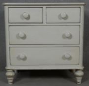 A Victorian style painted chest of two short above two long drawers on turned supports. H.77 W.76