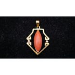 An Art Deco 18 carat yellow gold and coral pendant, set with two round brilliant cut diamonds and