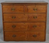 A Victorian pitch pine chest of two short above three long drawers. H.94 W.106 D.52.5cm