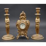 A pair of Classical style gilt metal candlesticks with caryatid stems and a French style gilt