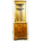 A Georgian style yew wood two section corner cabinet. H.213 W.70 D.48