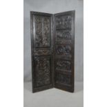 An antique oak single fold screen with a pair of foliate and mask carved panels. H.180 W.56cm (