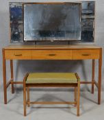 A mid century vintage teak Heal's dressing table and matching dressing stool with Heal's exclusive