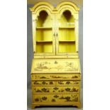 A mid Georgian style Chinoiserie lacquered bureau bookcase, the upper double domed bookcase