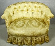 A 19th century two seater tub sofa in deep buttoned damask upholstery on turned tapering supports.