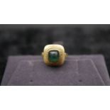 A 14 carat yellow gold and tourmaline dress ring. Set with a sugar loaf tourmaline with an