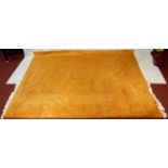 A large 1970's vintage woollen carpet in tangerine retailed by Heal's. L.380 W.280cm