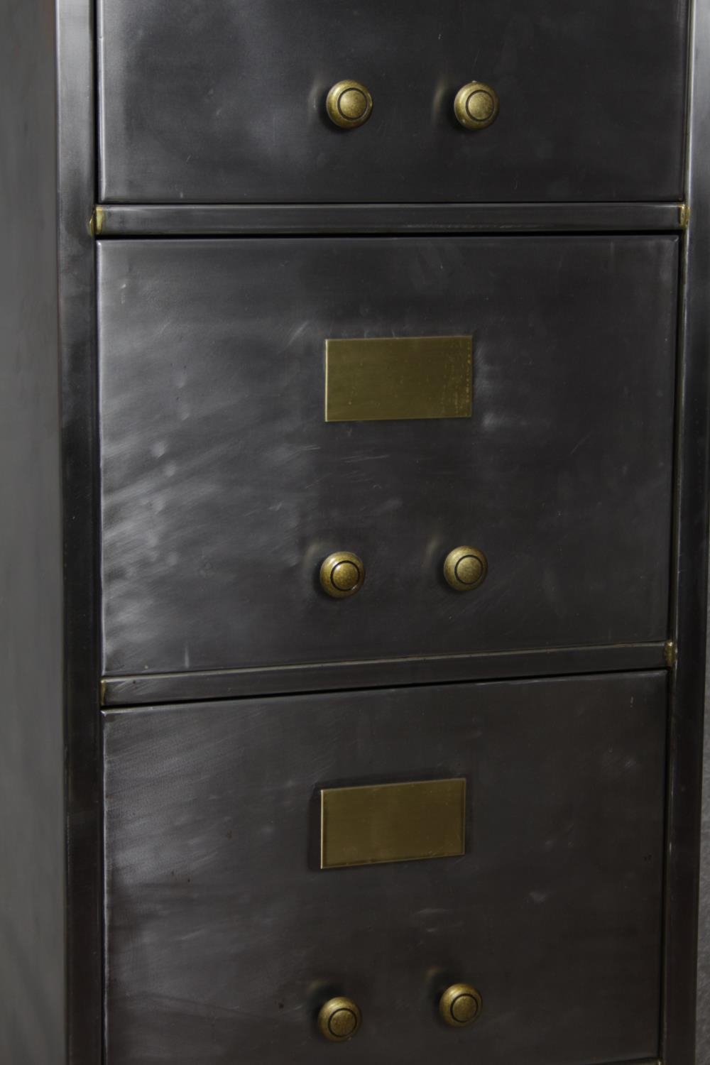 A vintage polished steel filing cabinet with twin brass handles and brass plate to each drawer. H. - Image 5 of 11