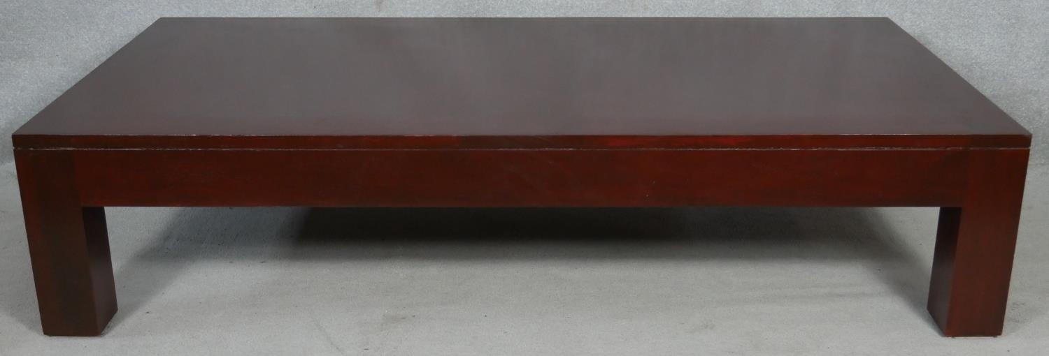 A large contemporary coffee table on block supports. H.41.5 L.182 W.92cm