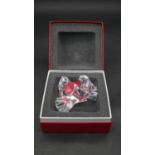 A boxed Baccarat crystal figure of two doves. Signed, stamped and labelled and with certificate. H.