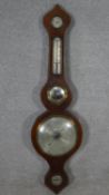 A 19th century mahogany and satinwood strung banjo barometer with silvered dial and fitted with