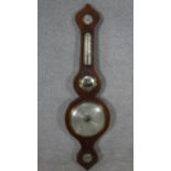 A 19th century mahogany and satinwood strung banjo barometer with silvered dial and fitted with