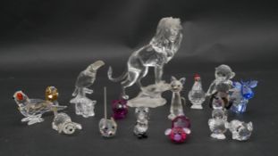 A collection of seventeen Swarovski cut crystal miniature animals to include a roaring lion,