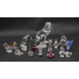 A collection of seventeen Swarovski cut crystal miniature animals to include a roaring lion,