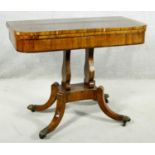 A Regency rosewood card table with foldover baize lined top on twin lyre shaped supports resting