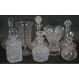 A collection of six glass decanters and stoppers along with two cut crystal vases. H.29cm