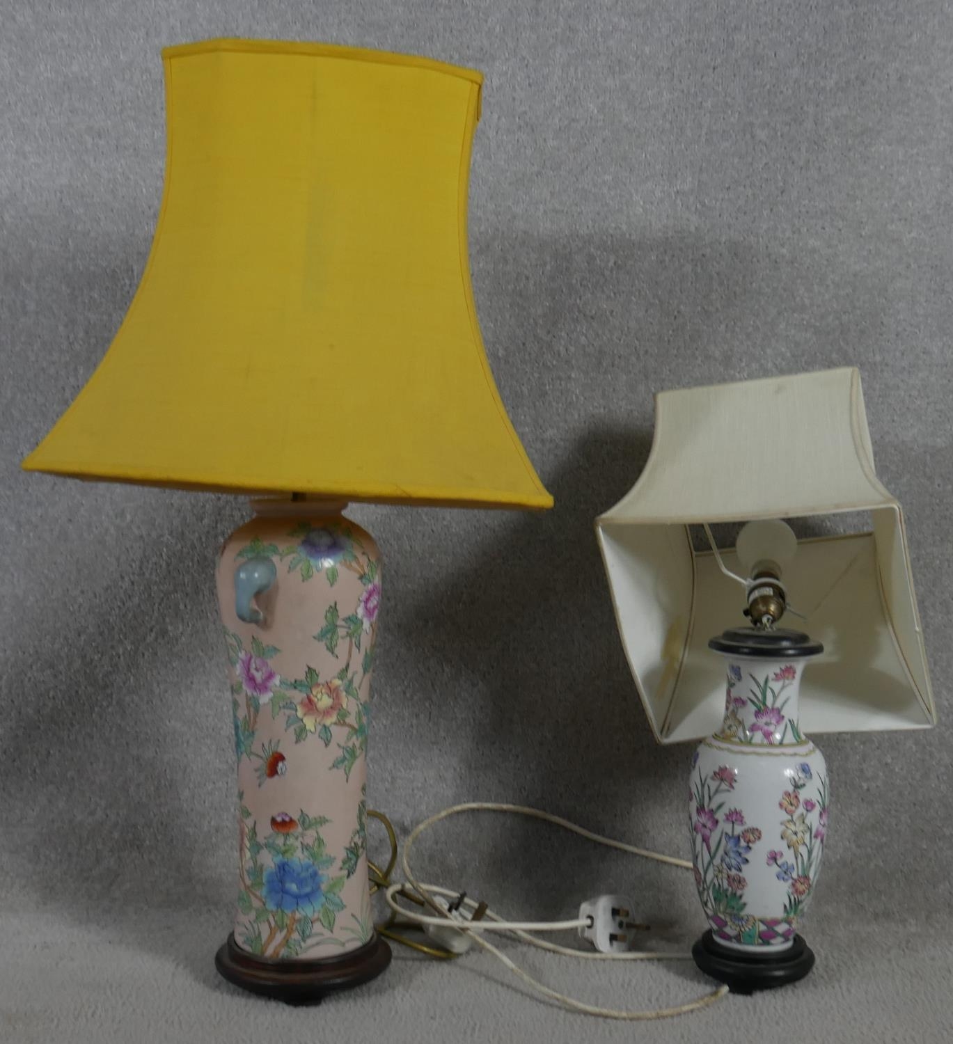 A Chinese style baluster form table lamp on hardwood base and a similar lamp. H.75cm (One in need of