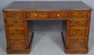 A late 19th century burr elm three section desk with inset gilt tooled leather top on twin pedestals